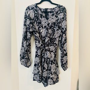 Amazon. Black and white floral romper. Size large (L)